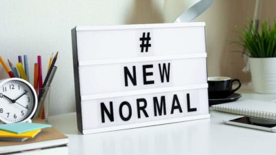 New normal sign on desk